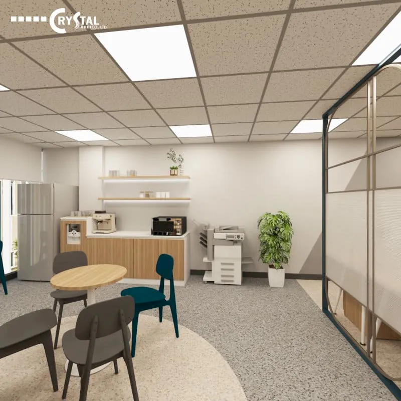 Khu vực pantry văn phòng hiện đại với bàn ghế ăn nhẹ, máy in và tủ lạnh tiện nghi.