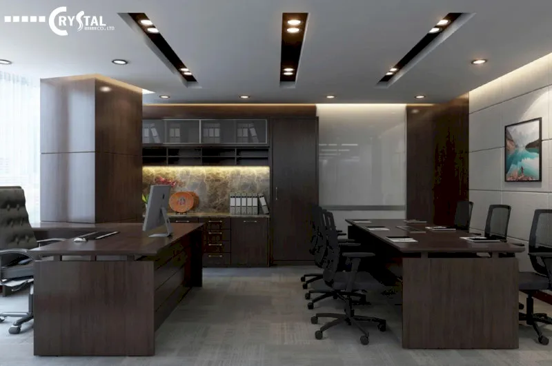 Văn phòng lãnh đạo cao cấp với nội thất gỗ tối màu, bàn làm việc và khu vực họp nhỏ liền kề.
