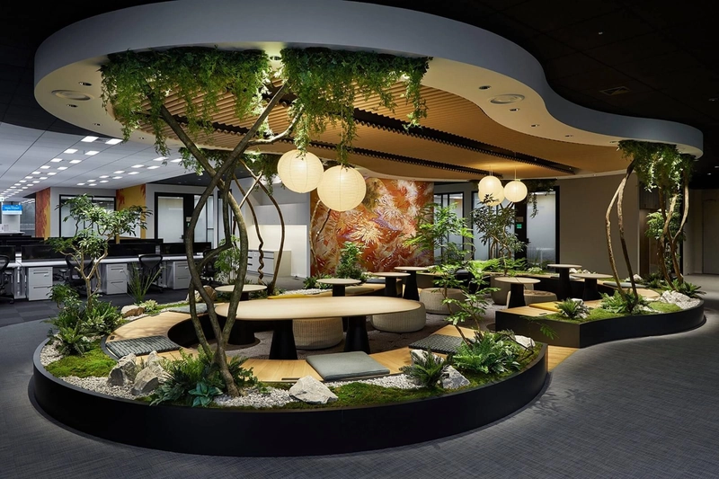 office interior design with large plants as soft dividers