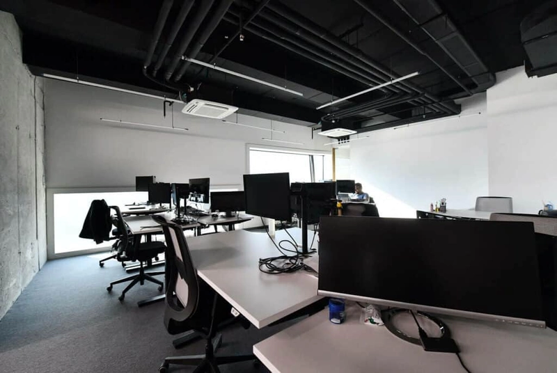 modern contemporary office interior design with exposed concrete ceiling