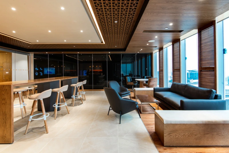 Dark-toned hardwoods are the structural and visual anchors of any Indochine-influenced office (Source: Internet)