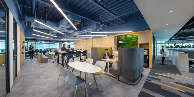Movable partitions and diverse seating create an agile layout that fluidly adapts to human behavior, a core principle of modern workspace interior design