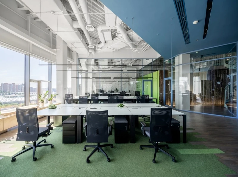 Integrated smart technology ensures a seamless, cable-free surface on this impeccably tidy common desk setup