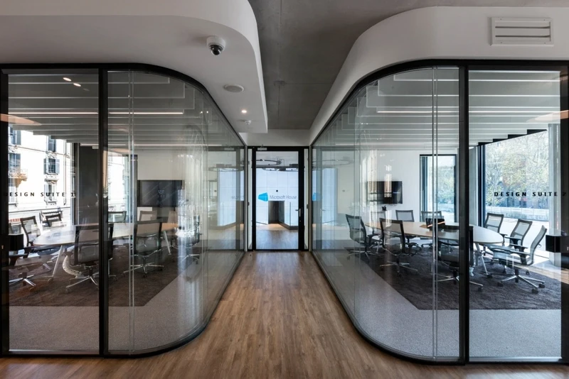 Suspended ceiling elements that break up sound waves for conference rooms