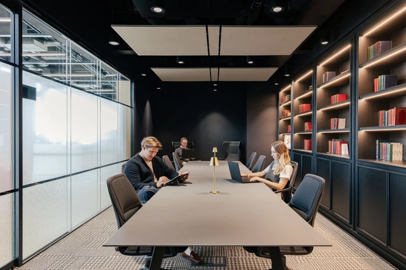 Linear LED lighting system with micro-prismatic diffusers designed to eliminate glare on employee workstations