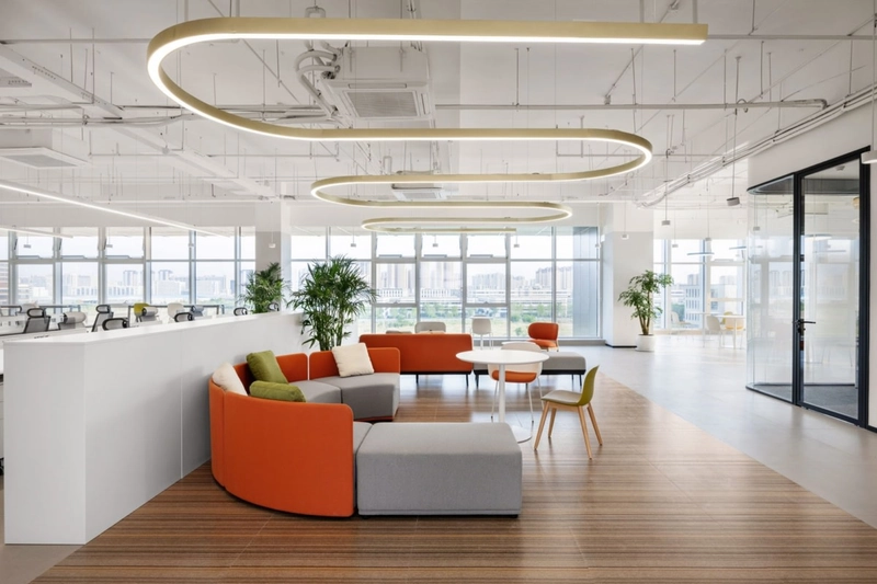 Suspended direct/indirect lighting fixtures brighten the ceiling while providing precise, glare-free illumination on the working surfaces below