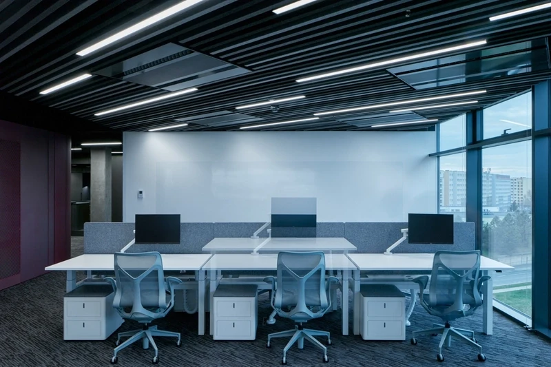 Motorized sit-to-stand desks encourage dynamic posture changes throughout the day, significantly boosting metabolic health and sustained focus